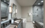 En-suite master bathroom with Jacuzzi tub and walk-in shower.